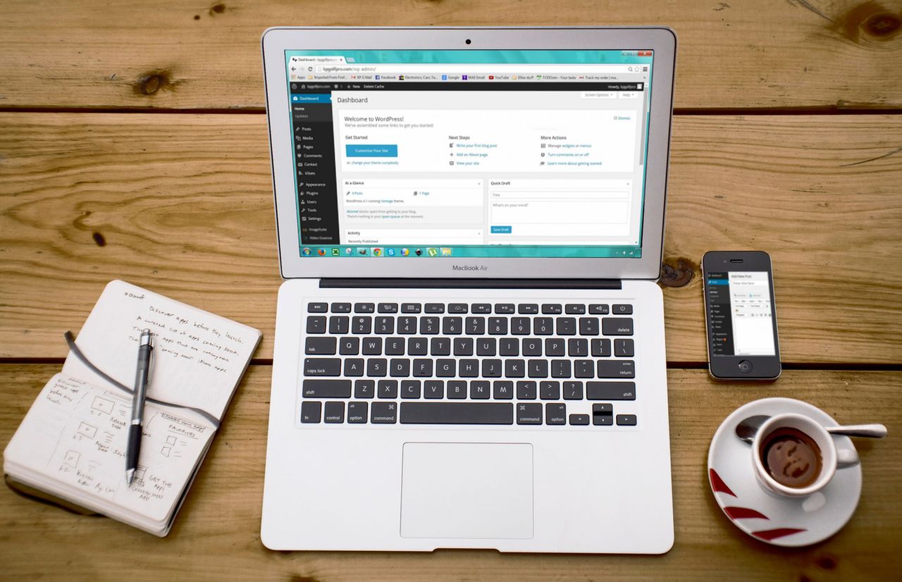 heros-img A cozy home office scene with a laptop, notebook, smartphone, and coffee, perfect for productivity.